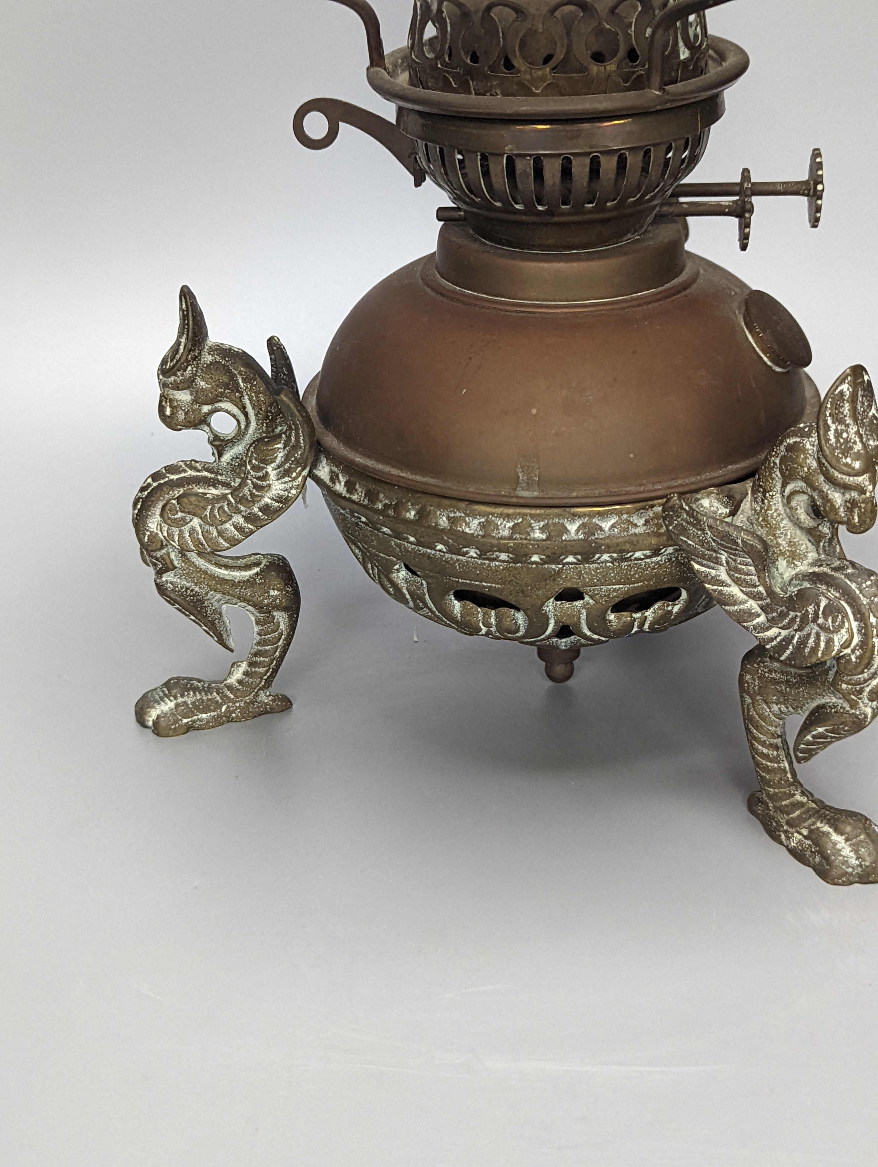 A brass and copper animal monopodia oil lamp, height 36cm